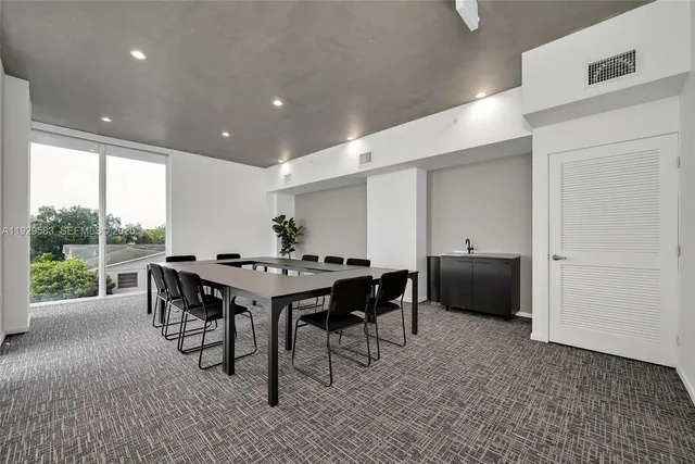 a room with furniture and potted plant