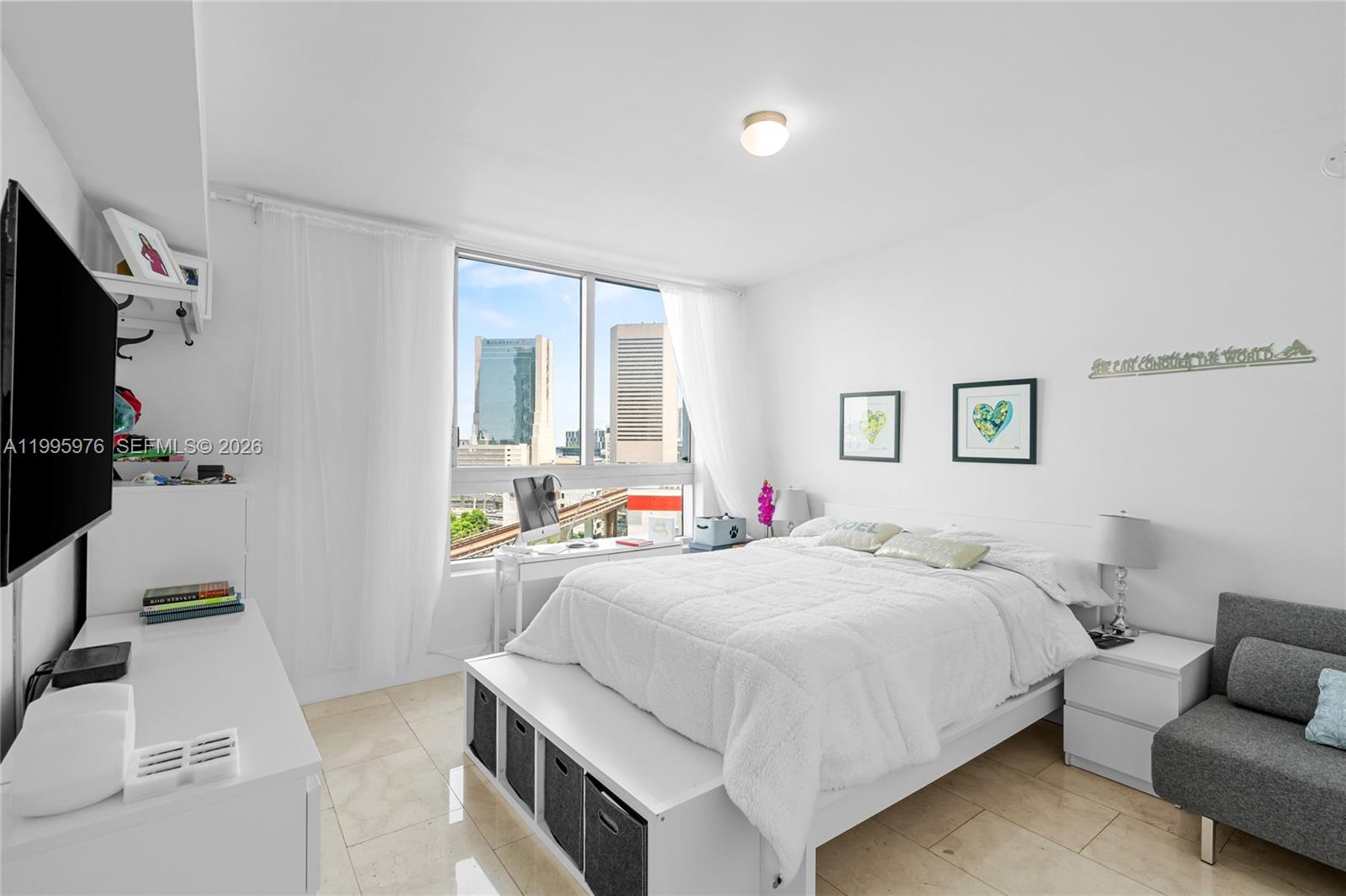 90 Southwest 3rd Street, Unit 1209 Miami, FL 33130 - Photo 17 of 33 a bedroom with a bed and a flat screen tv