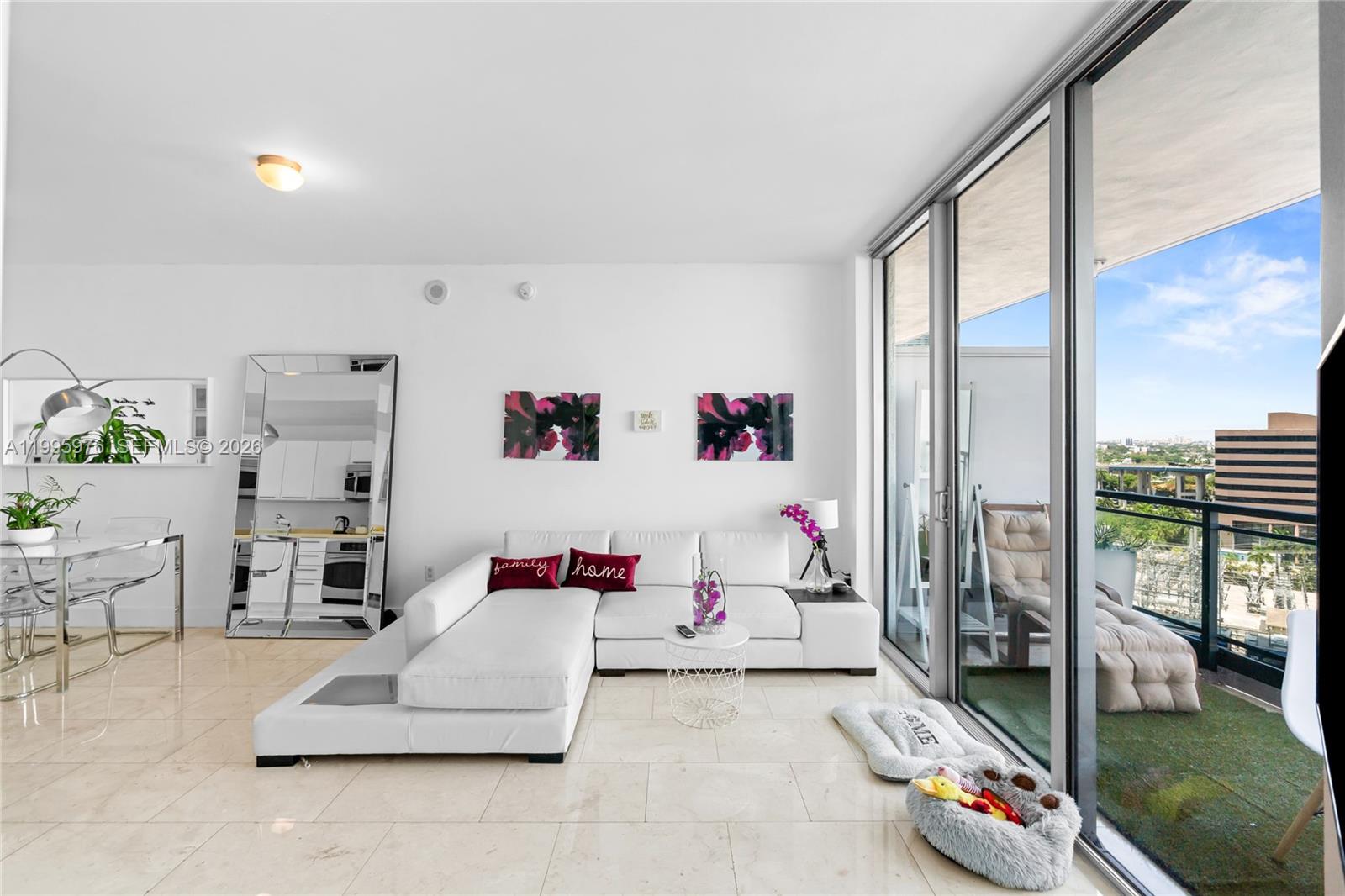 90 Southwest 3rd Street, Unit 1209 Miami, FL 33130 - Photo 6 of 33 a living room with furniture and a floor to ceiling window