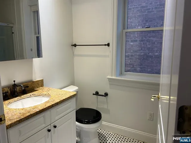a bathroom with a glass shower door