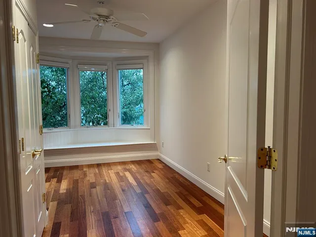 a kitchen with a sink a counter top space and stainless steel appliances
