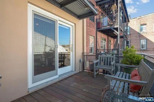 a front view of a house with plants