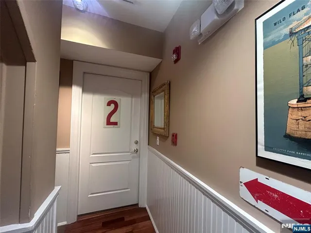 a view of a room with wooden floor and closet