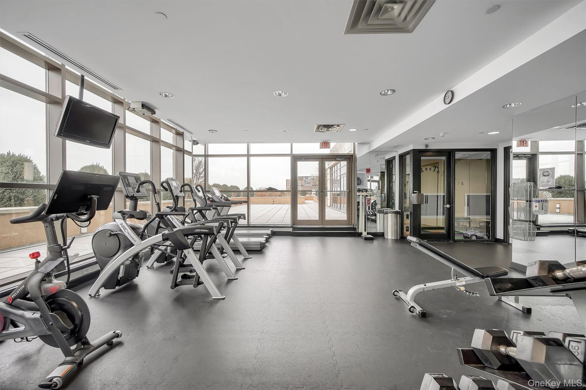 175 Huguenot Street, Unit 2108 New Rochelle, NY 10801 - Photo 15 of 18 a view of a room with gym equipment