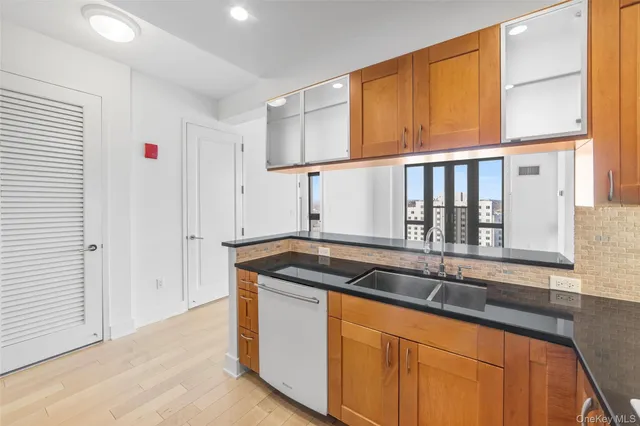 a kitchen that has a sink and a window