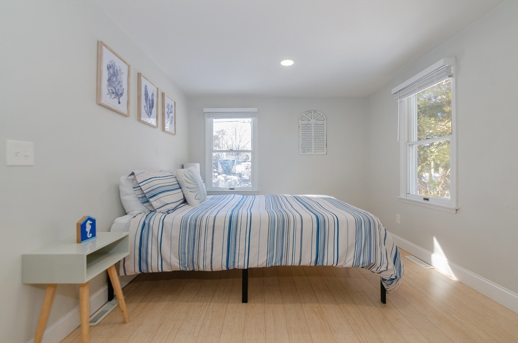 56 Acushnet Road Mattapoisett, MA 02739 - Photo 13 of 23 a bedroom with a bed and a window