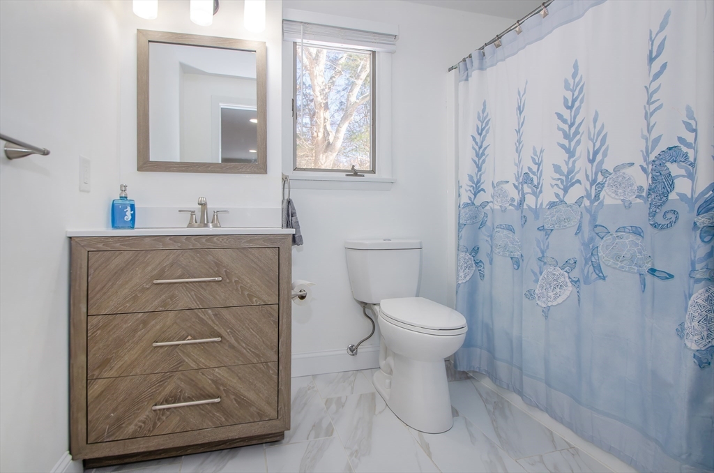 56 Acushnet Road Mattapoisett, MA 02739 - Photo 15 of 23 a bathroom with a toilet sink and shower