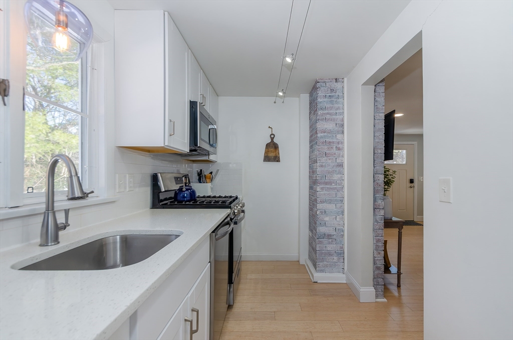 56 Acushnet Road Mattapoisett, MA 02739 - Photo 3 of 23 a kitchen with a sink stove and refrigerator