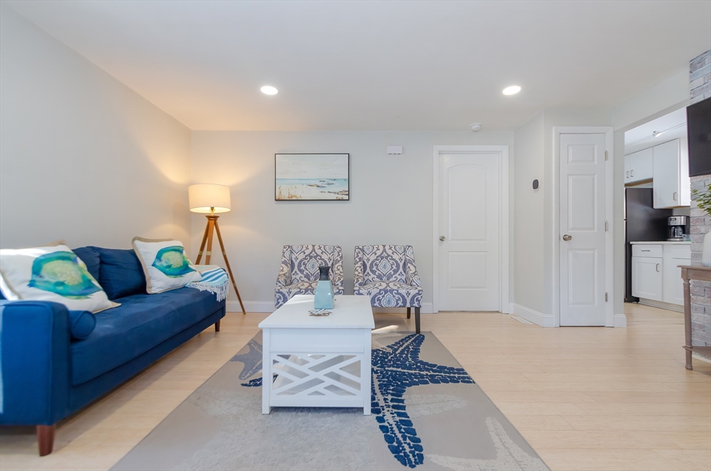 56 Acushnet Road Mattapoisett, MA 02739 - Photo 5 of 23 a living room with furniture and a rug