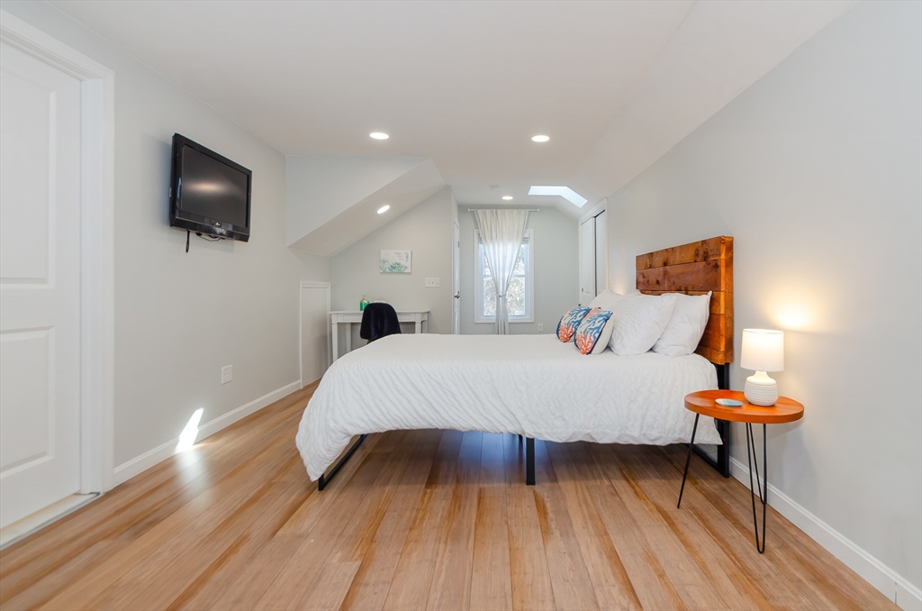 56 Acushnet Road Mattapoisett, MA 02739 - Photo 8 of 23 a bed room with a bed and a television