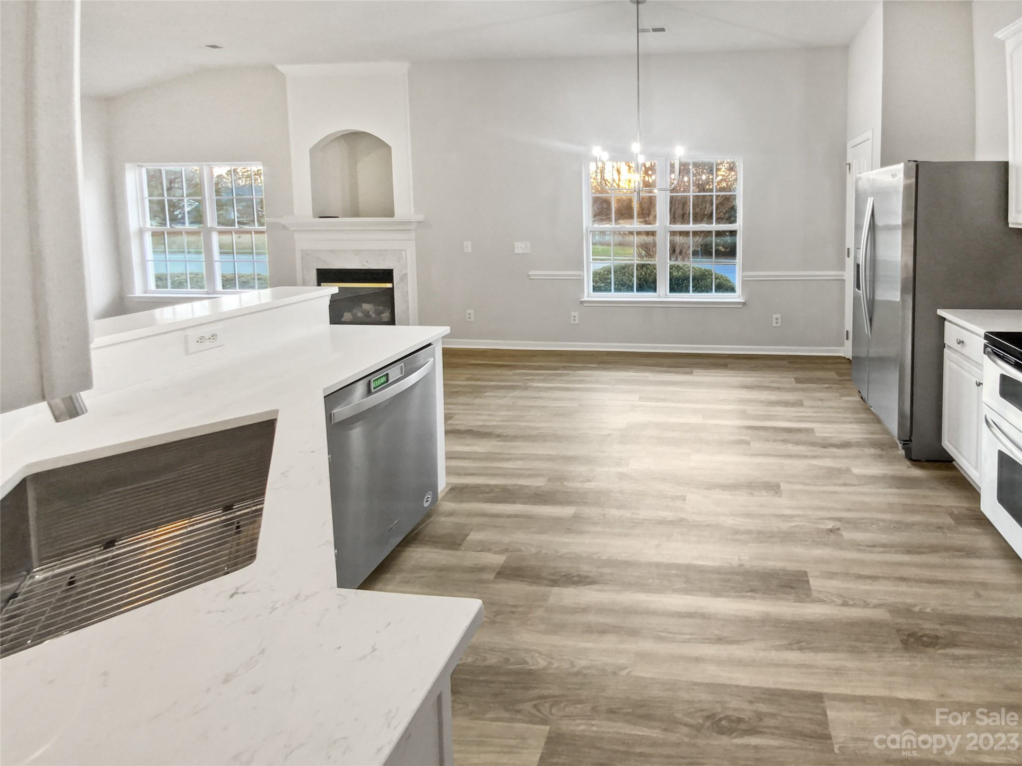 6710 Reedy Creek Road Charlotte, NC 28215 - Photo 13 of 26 a kitchen with stainless steel appliances a stove a refrigerator sink and microwave