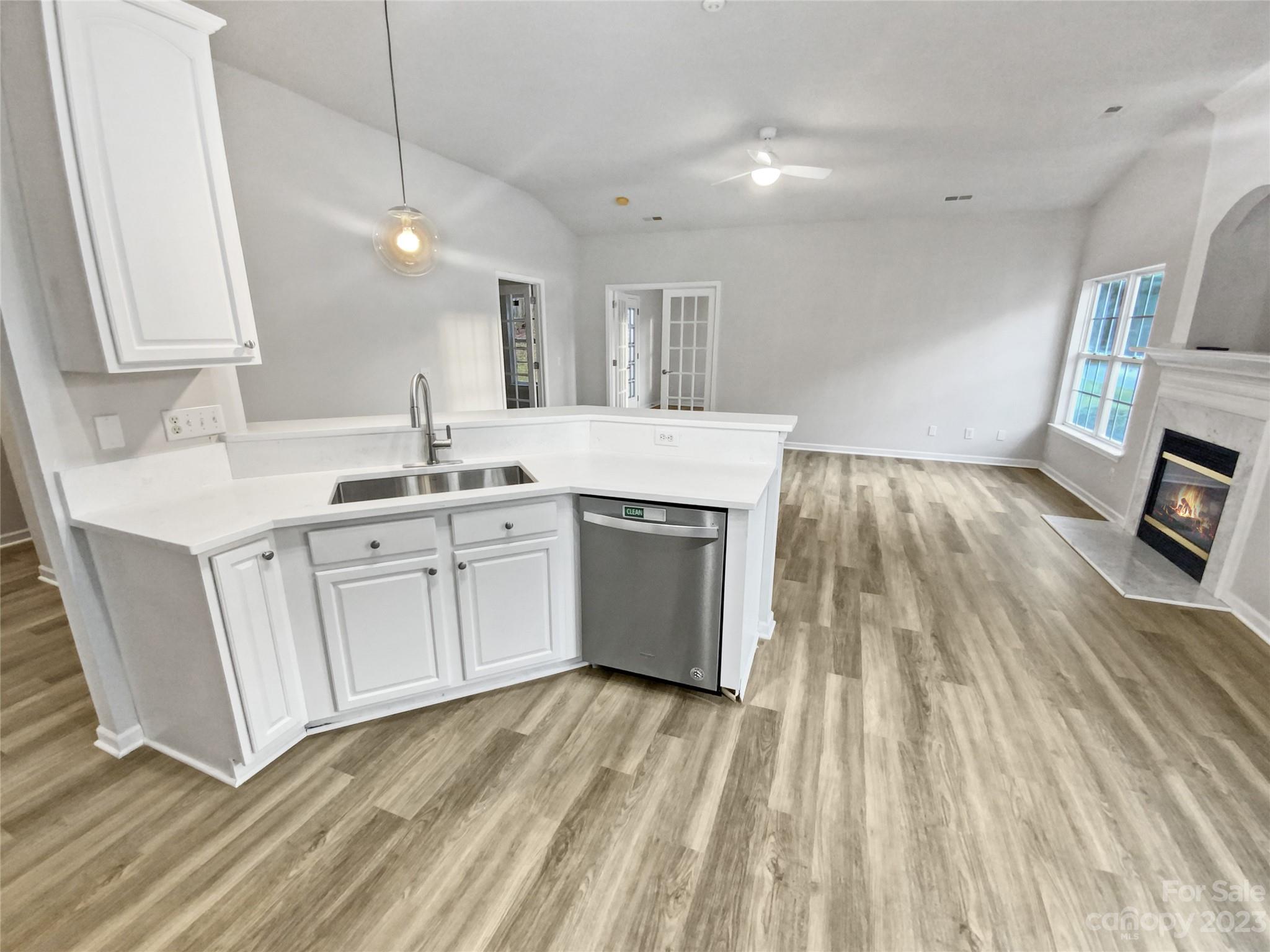6710 Reedy Creek Road Charlotte, NC 28215 - Photo 16 of 26 a kitchen with a sink stove and cabinets