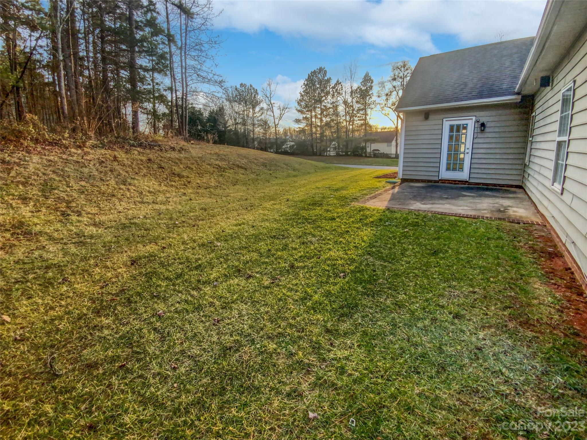 6710 Reedy Creek Road Charlotte, NC 28215 - Photo 9 of 26 a view of a yard with an tree