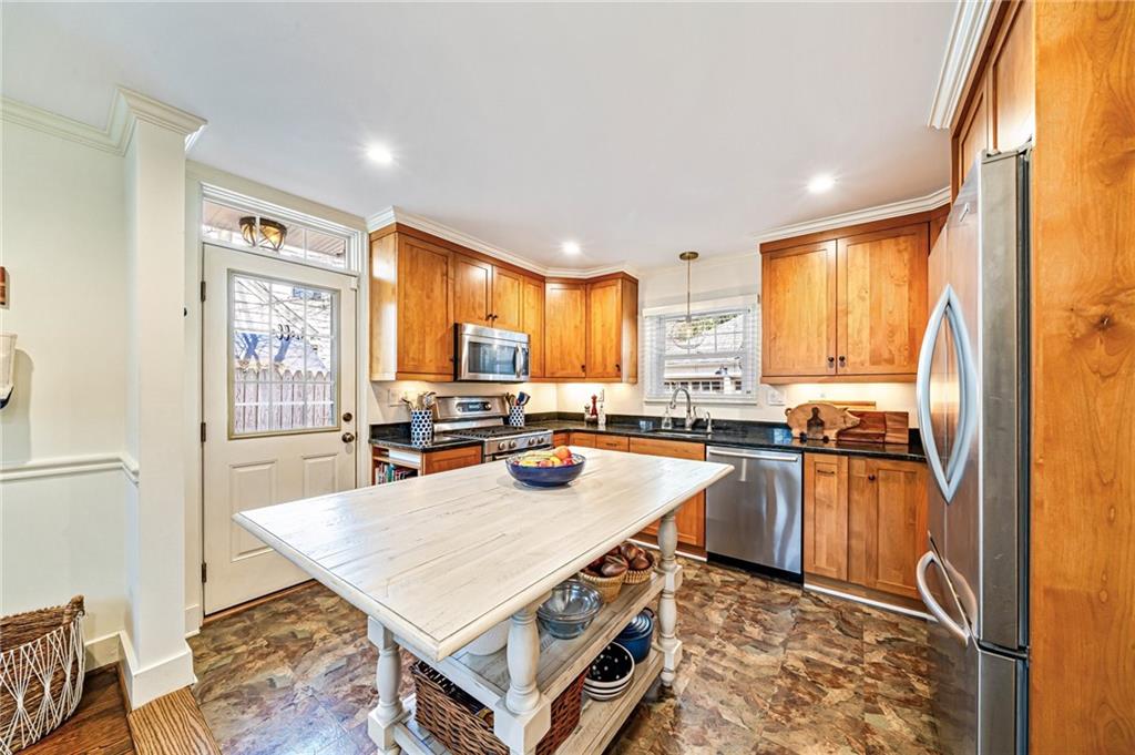 308 Maple Lane Sewickley, PA 15143 - Photo 18 of 40 a kitchen with stainless steel appliances granite countertop a stove a sink dishwasher and a refrigerator