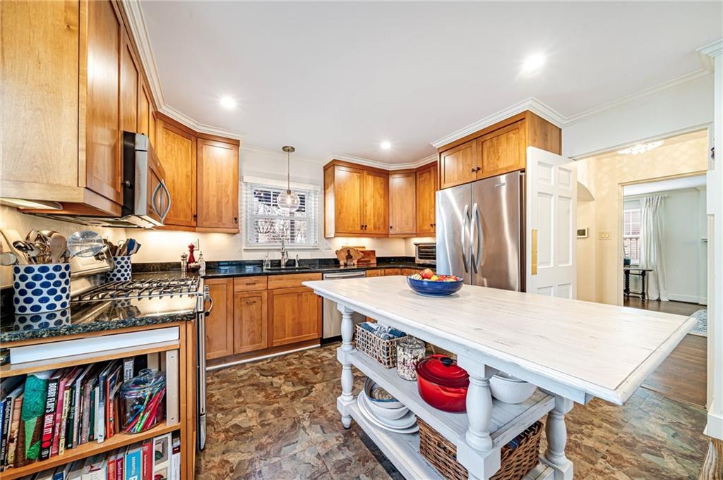 308 Maple Lane Sewickley, PA 15143 - Photo 20 of 40 a kitchen with stainless steel appliances granite countertop a refrigerator a stove and a sink with wooden floor