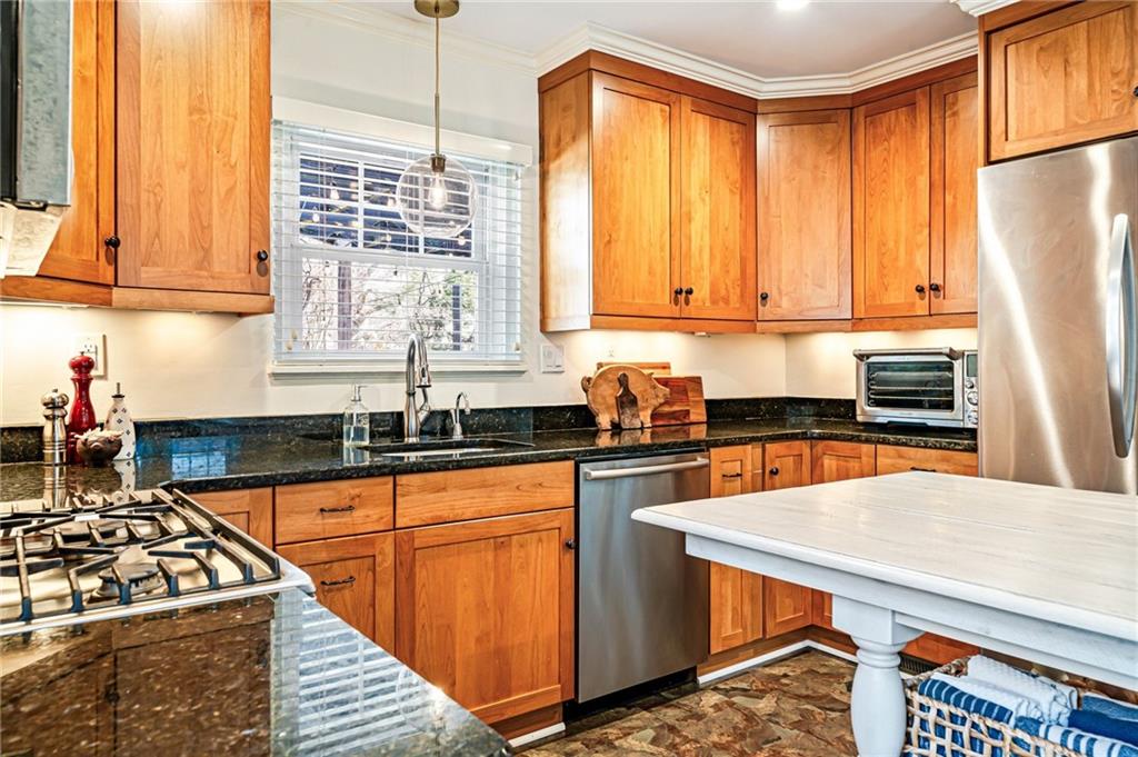 308 Maple Lane Sewickley, PA 15143 - Photo 21 of 40 a kitchen with stainless steel appliances a stove a sink refrigerator and cabinets