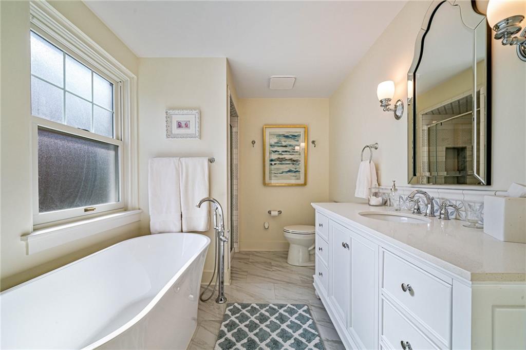 308 Maple Lane Sewickley, PA 15143 - Photo 26 of 40 a bathroom with a tub sink and mirror