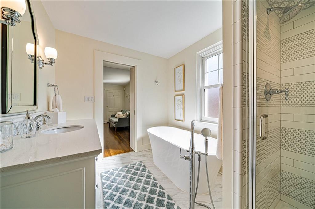 308 Maple Lane Sewickley, PA 15143 - Photo 27 of 40 a en suite bathroom with a double vanity sink and a mirror