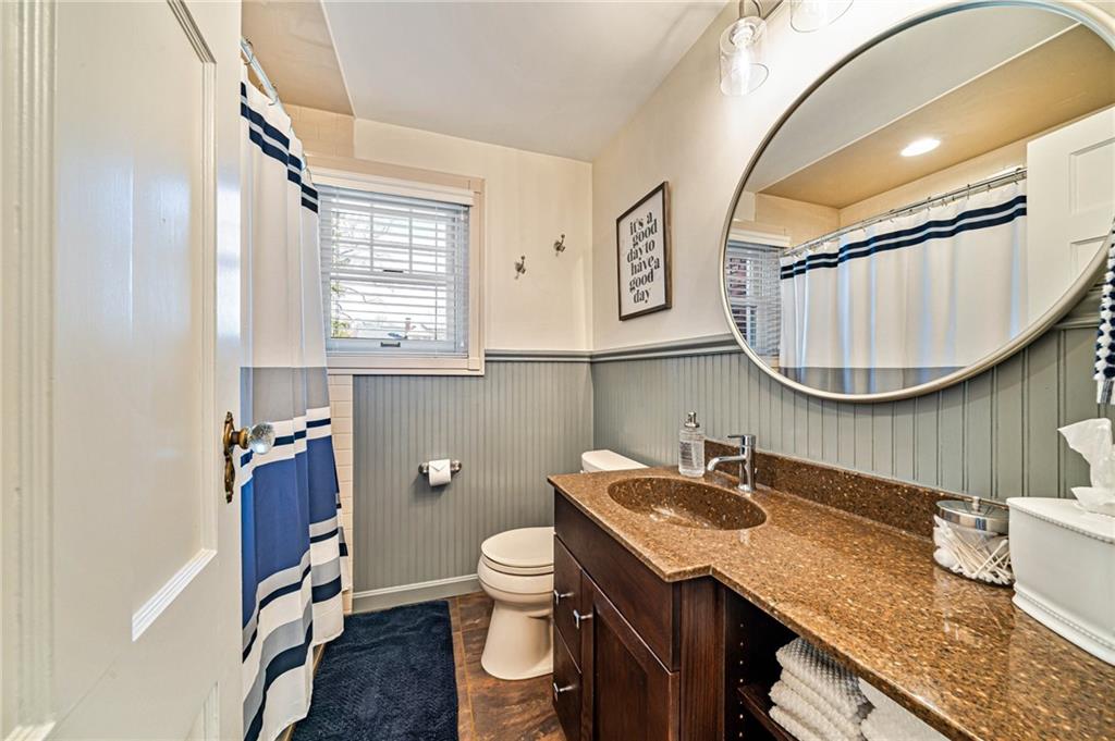 308 Maple Lane Sewickley, PA 15143 - Photo 30 of 40 a bathroom with a granite countertop toilet sink and mirror