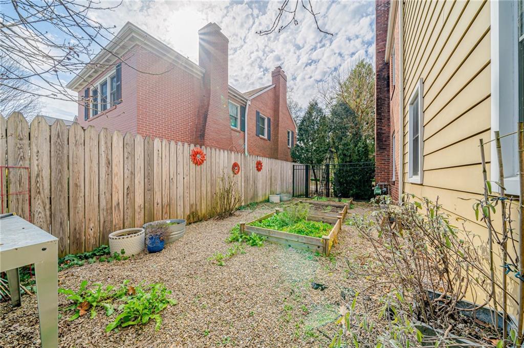 308 Maple Lane Sewickley, PA 15143 - Photo 39 of 40 a backyard of a house with garden and porch