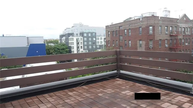a view of a balcony with an outdoor space