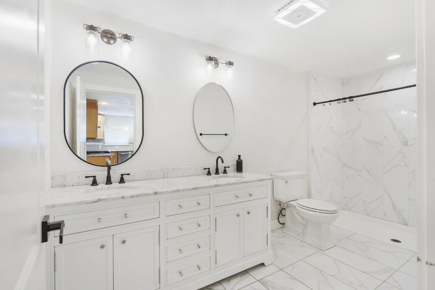 4729 Santa Rosa Avenue Robbins, CA 95676 - Photo 20 of 30 full bath with double vanity, a marble finish shower, light marble finish floors, and recessed lighting