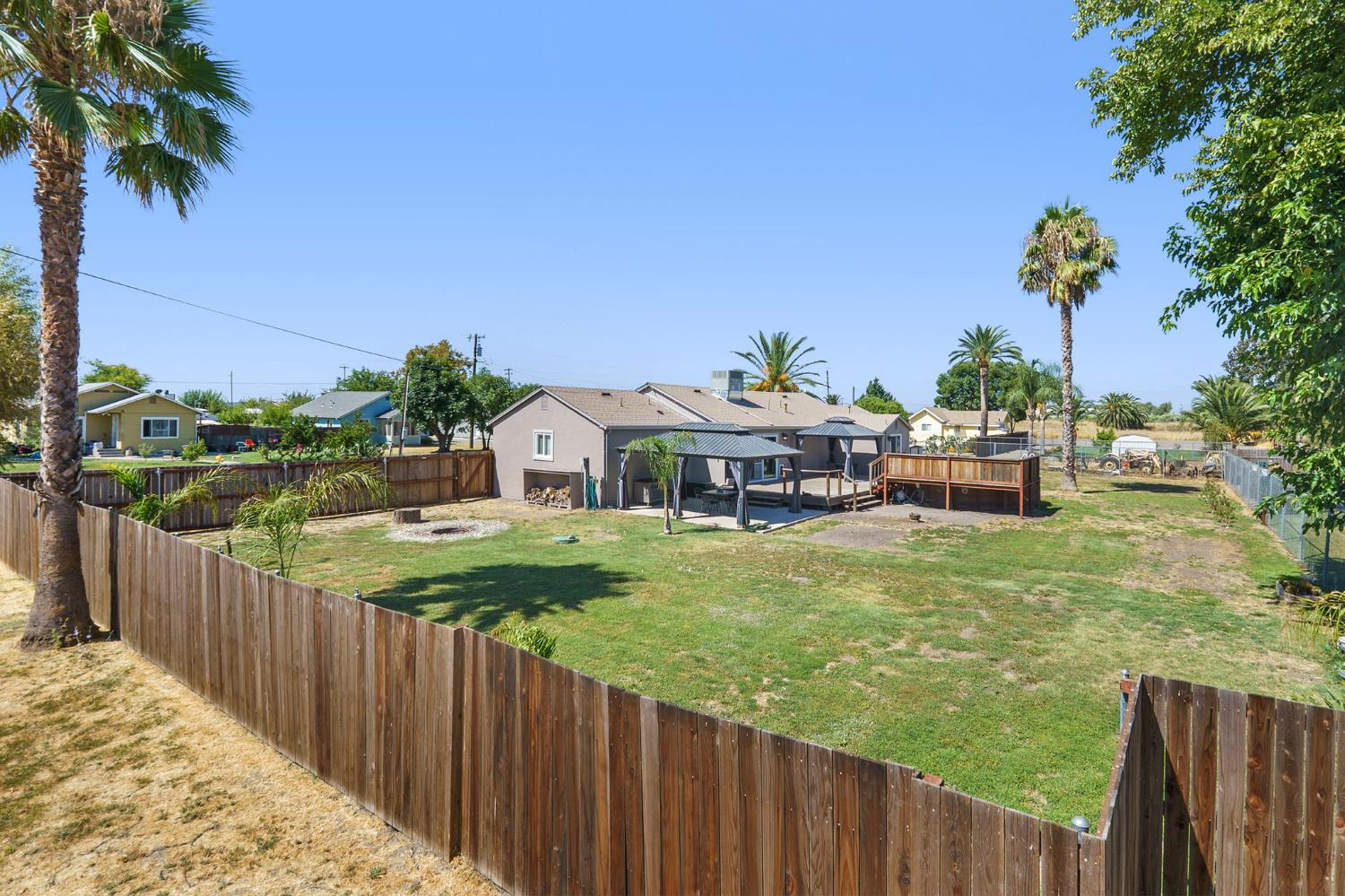 4729 Santa Rosa Avenue Robbins, CA 95676 - Photo 28 of 30 fenced backyard with a country view and an outdoor fire pit