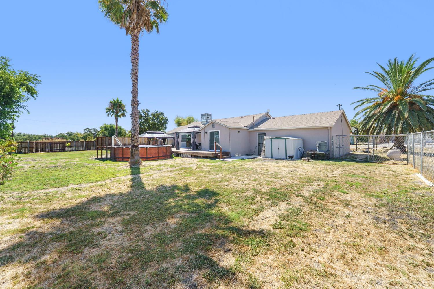 4729 Santa Rosa Avenue Robbins, CA 95676 - Photo 29 of 30 back of property featuring a fenced backyard and a patio area