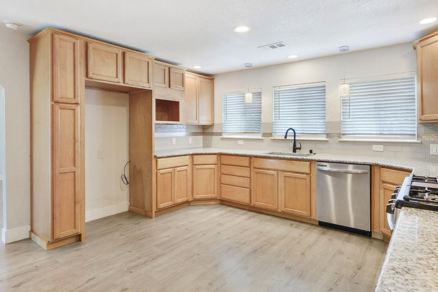 4729 Santa Rosa Avenue Robbins, CA 95676 - Photo 8 of 28 a kitchen with white cabinets and white appliances