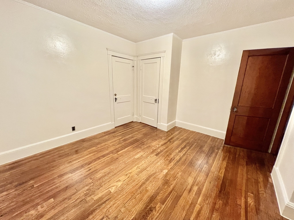 5 City View Road, Unit 2/F Boston, MA 02446 - Photo 9 of 14 a view of a room with wooden floor and bathroom