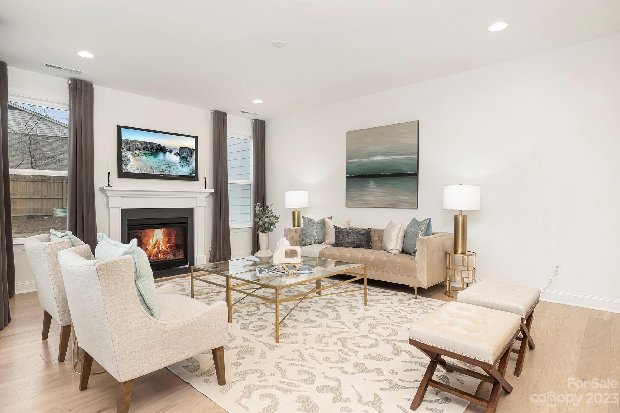 4013 Ashton Ridge Lane Charlotte, NC 28226 - Photo 10 of 13 a living room with furniture and a fireplace