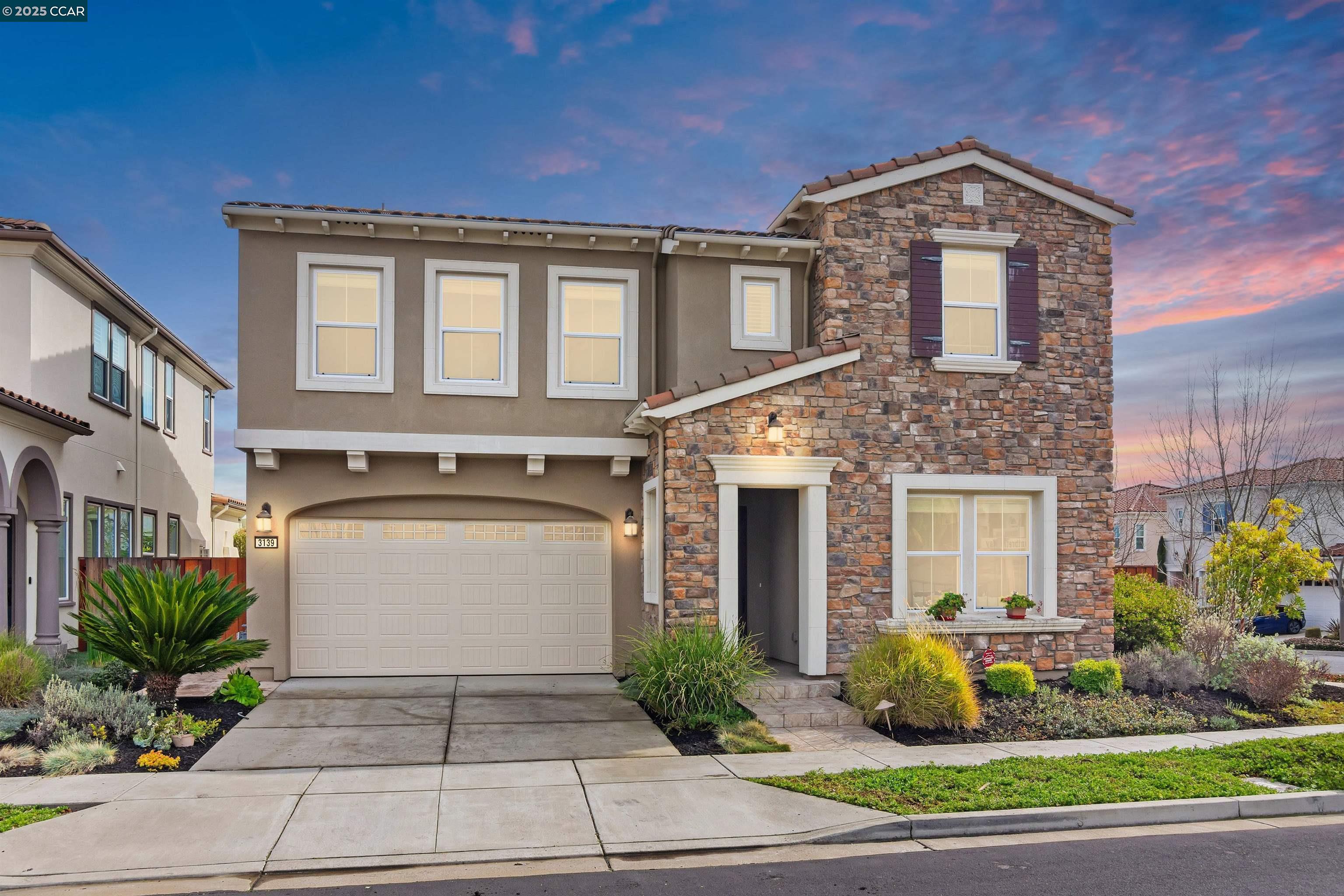 a front view of a house with garden