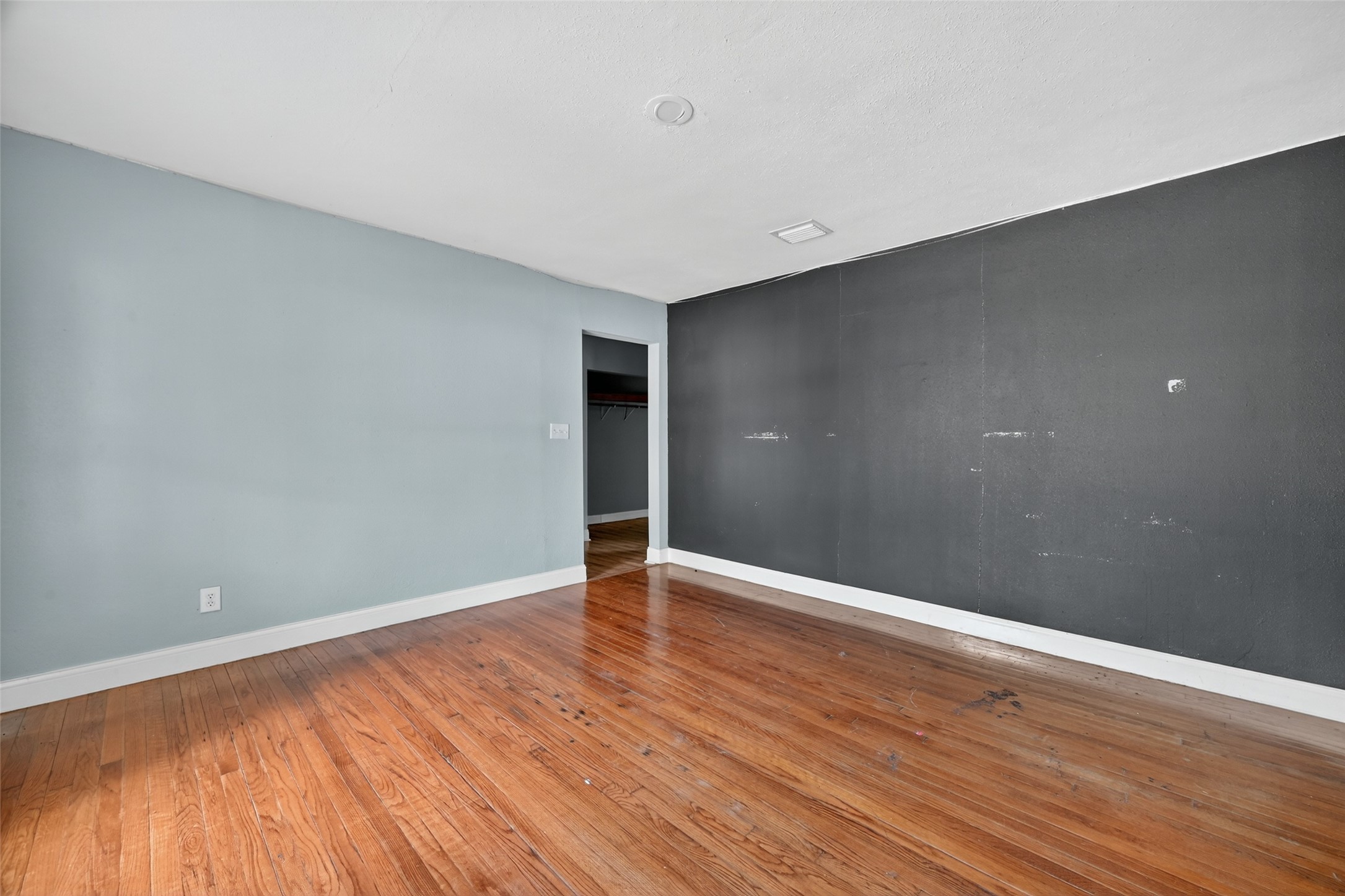 6434 Boothline Road Richmond, TX 77469 - Photo 22 of 36 a view of an empty room with wooden floor