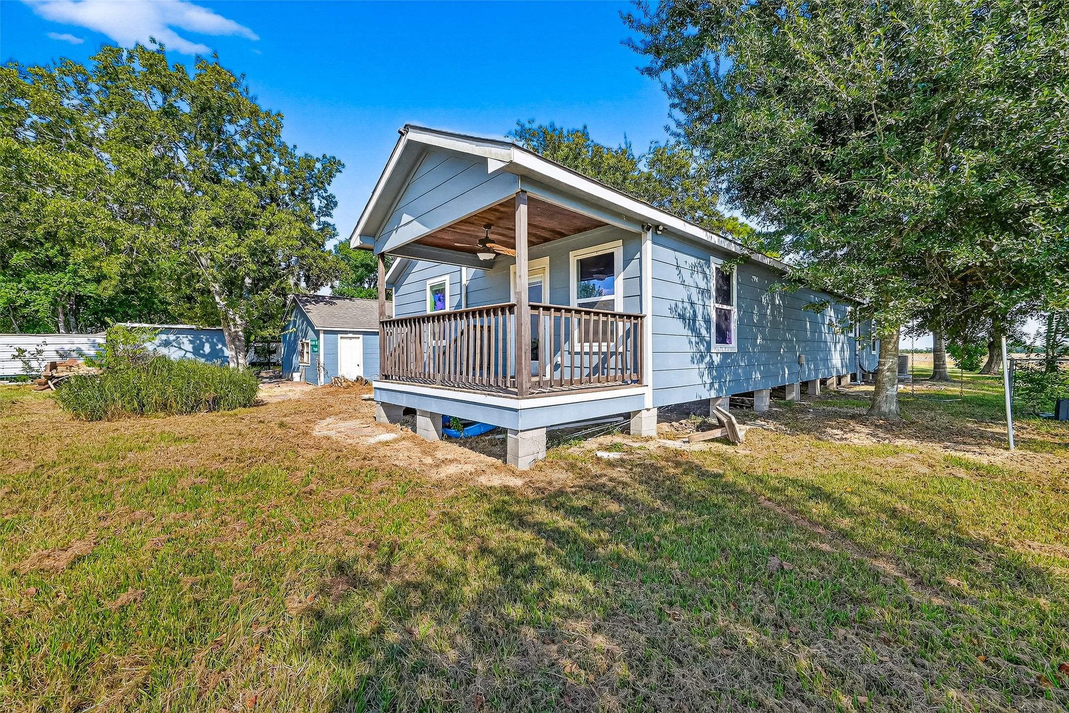 6434 Boothline Road Richmond, TX 77469 - Photo 28 of 36 a view of a house with a small yard and wooden fence