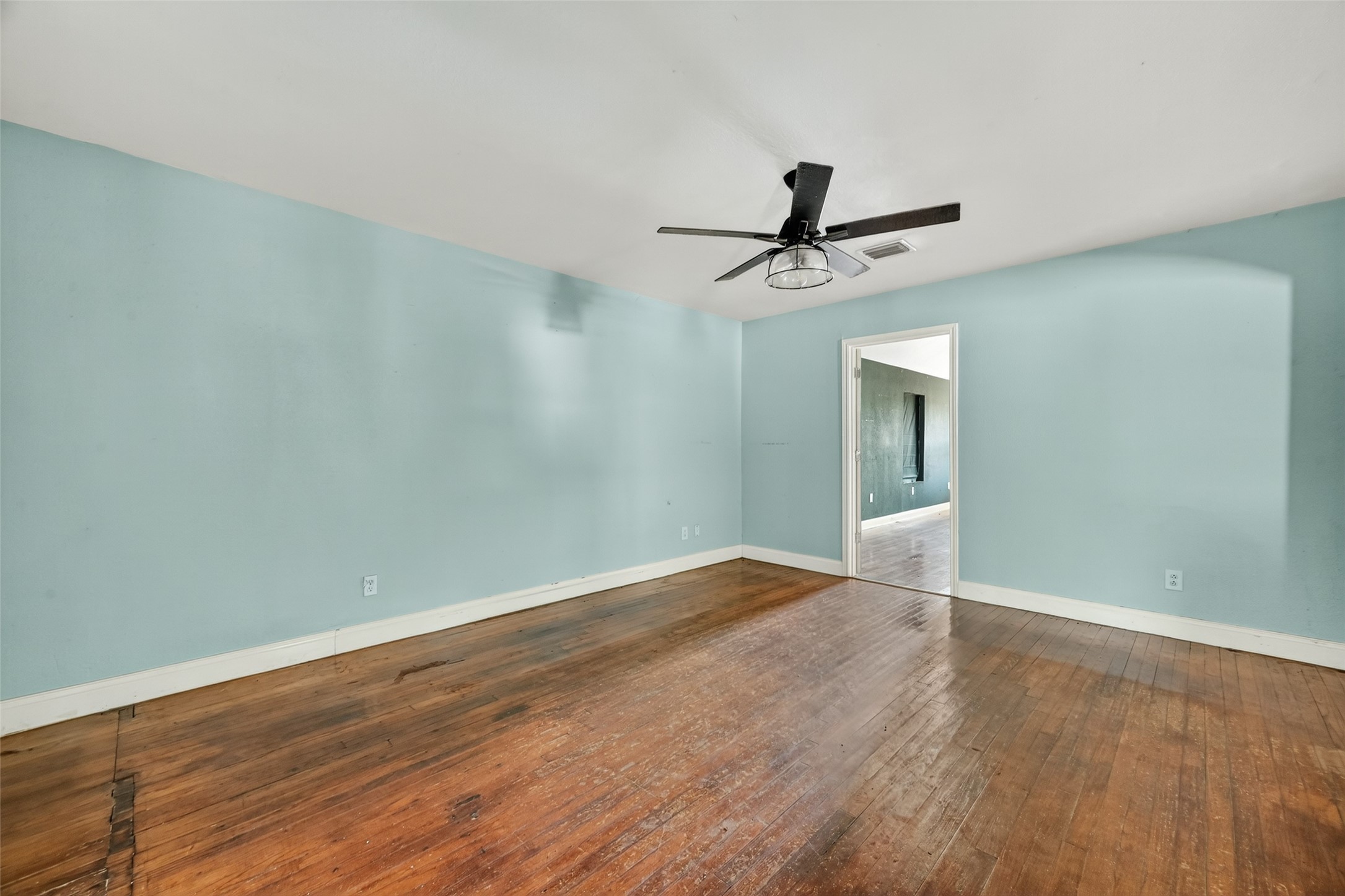 6434 Boothline Road Richmond, TX 77469 - Photo 10 of 36 wooden floor in an empty room