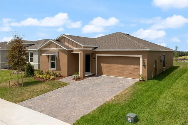 a view of house with yard and entertaining space