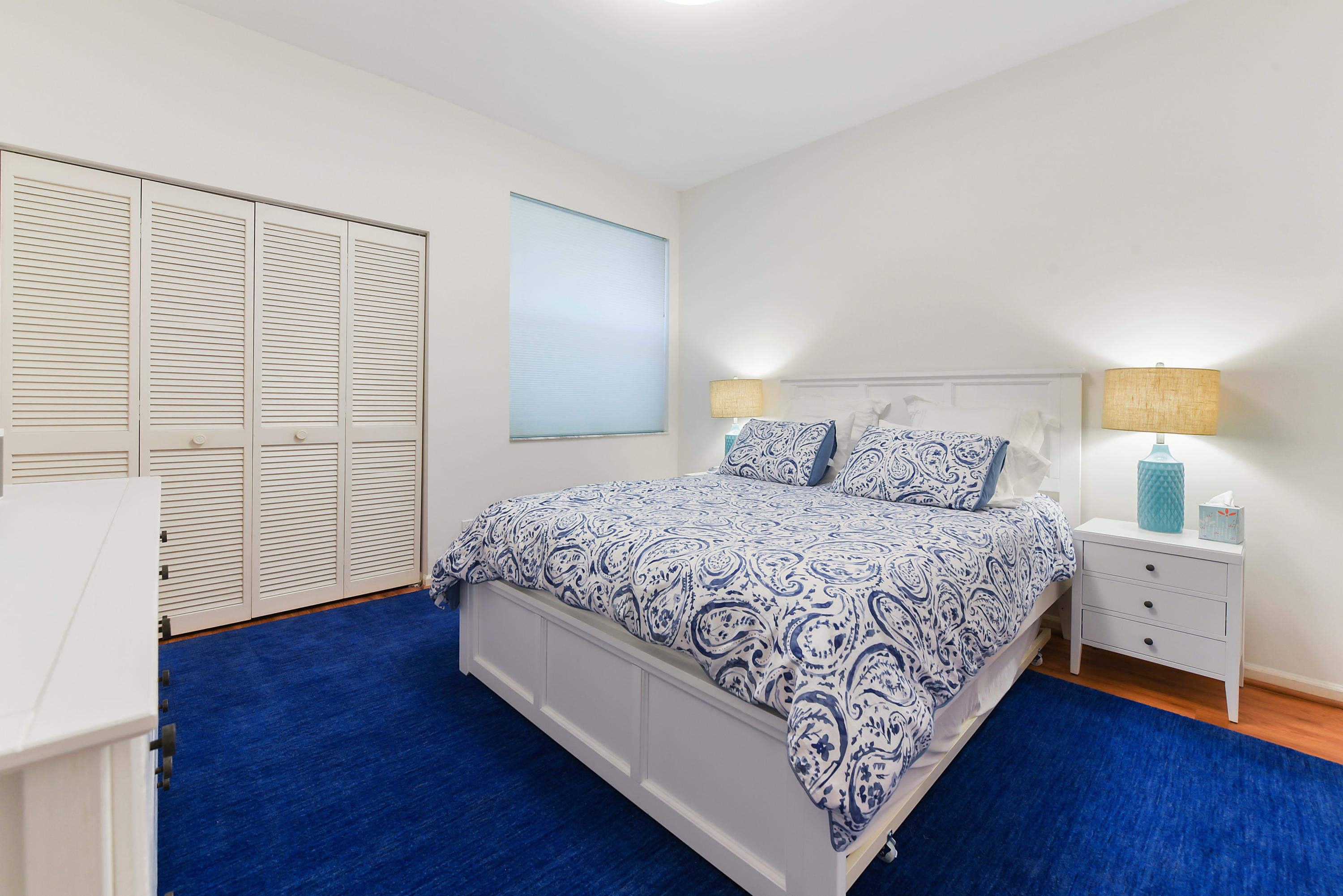 6606 Northwest 23rd Terrace Boca Raton, FL 33496 - Photo 13 of 21 a bedroom with a bed and a night stand