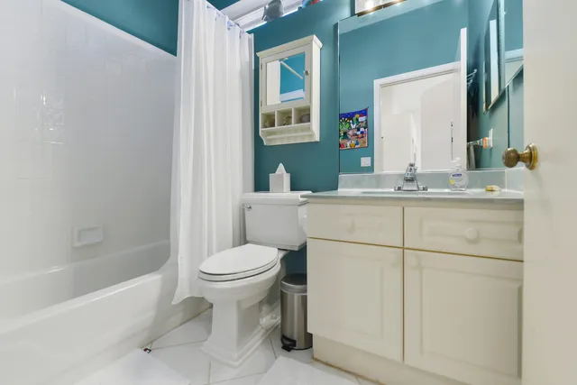 a bathroom with a sink toilet and mirror