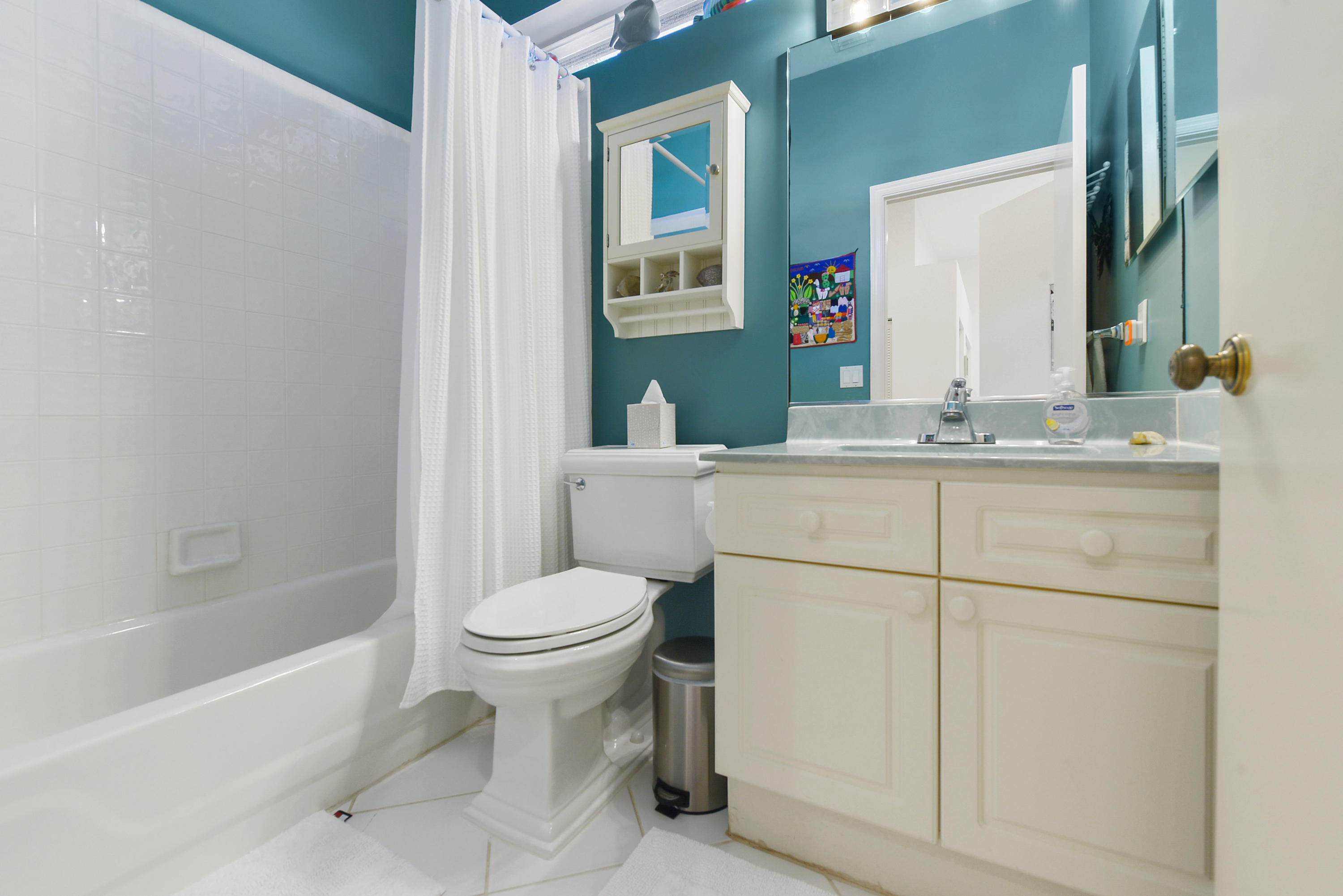 6606 Northwest 23rd Terrace Boca Raton, FL 33496 - Photo 14 of 21 a bathroom with a sink toilet and mirror