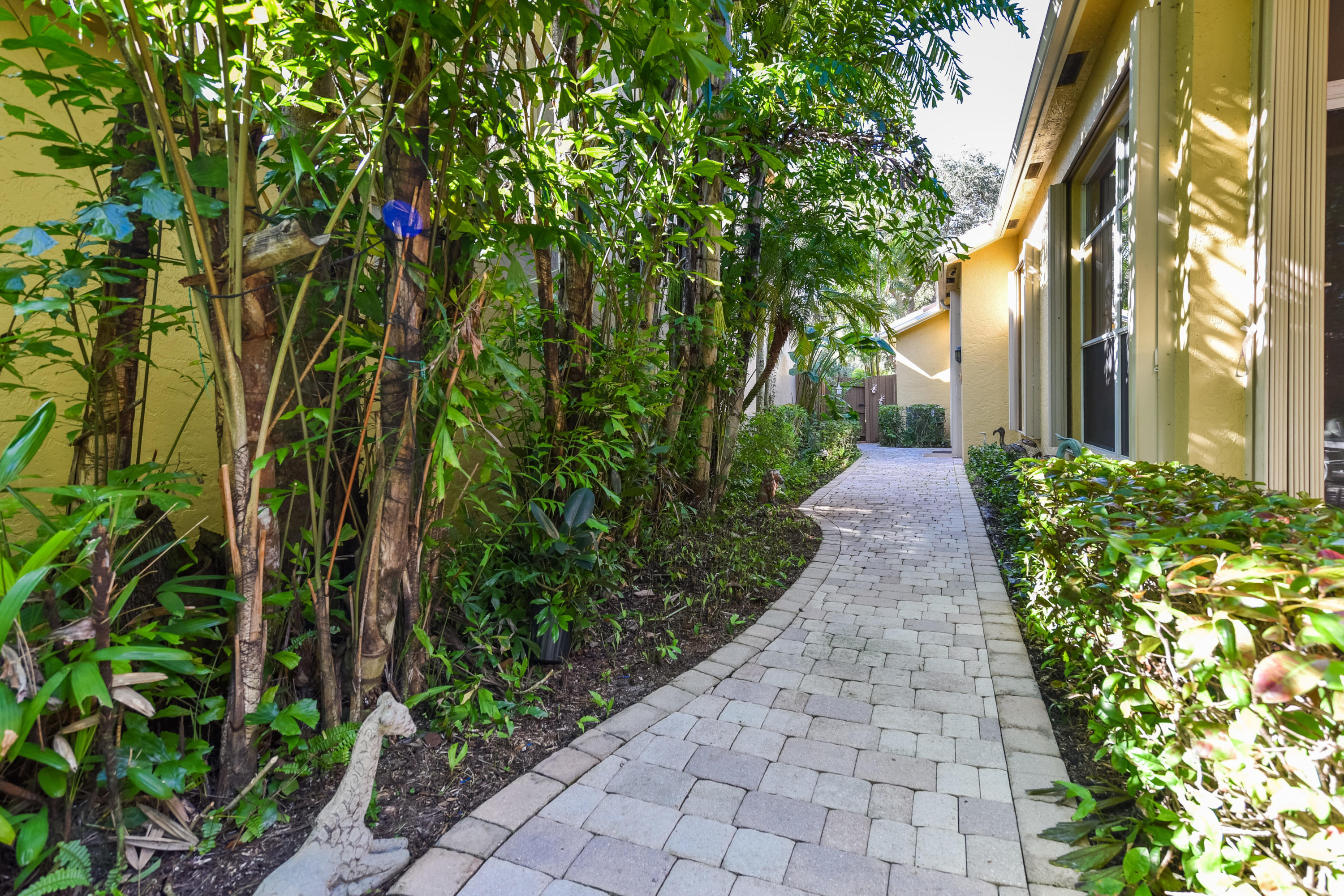 6606 Northwest 23rd Terrace Boca Raton, FL 33496 - Photo 15 of 21 a view of a pathway with plants