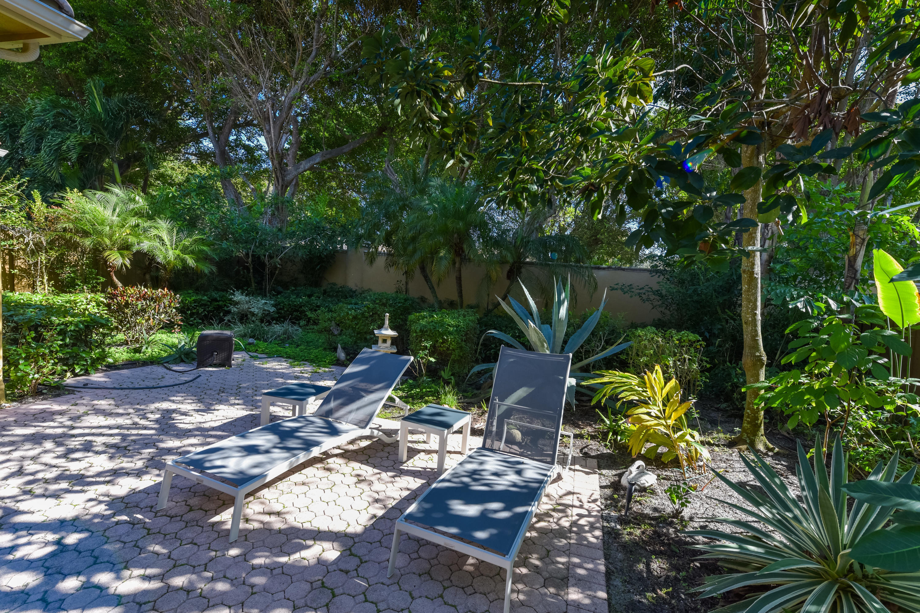 6606 Northwest 23rd Terrace Boca Raton, FL 33496 - Photo 16 of 21 a view of an outdoor space with garden
