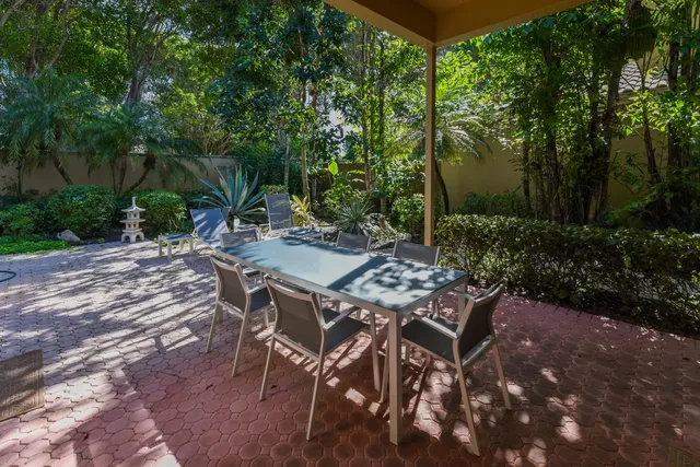 a view of an outdoor space with a table and chairs