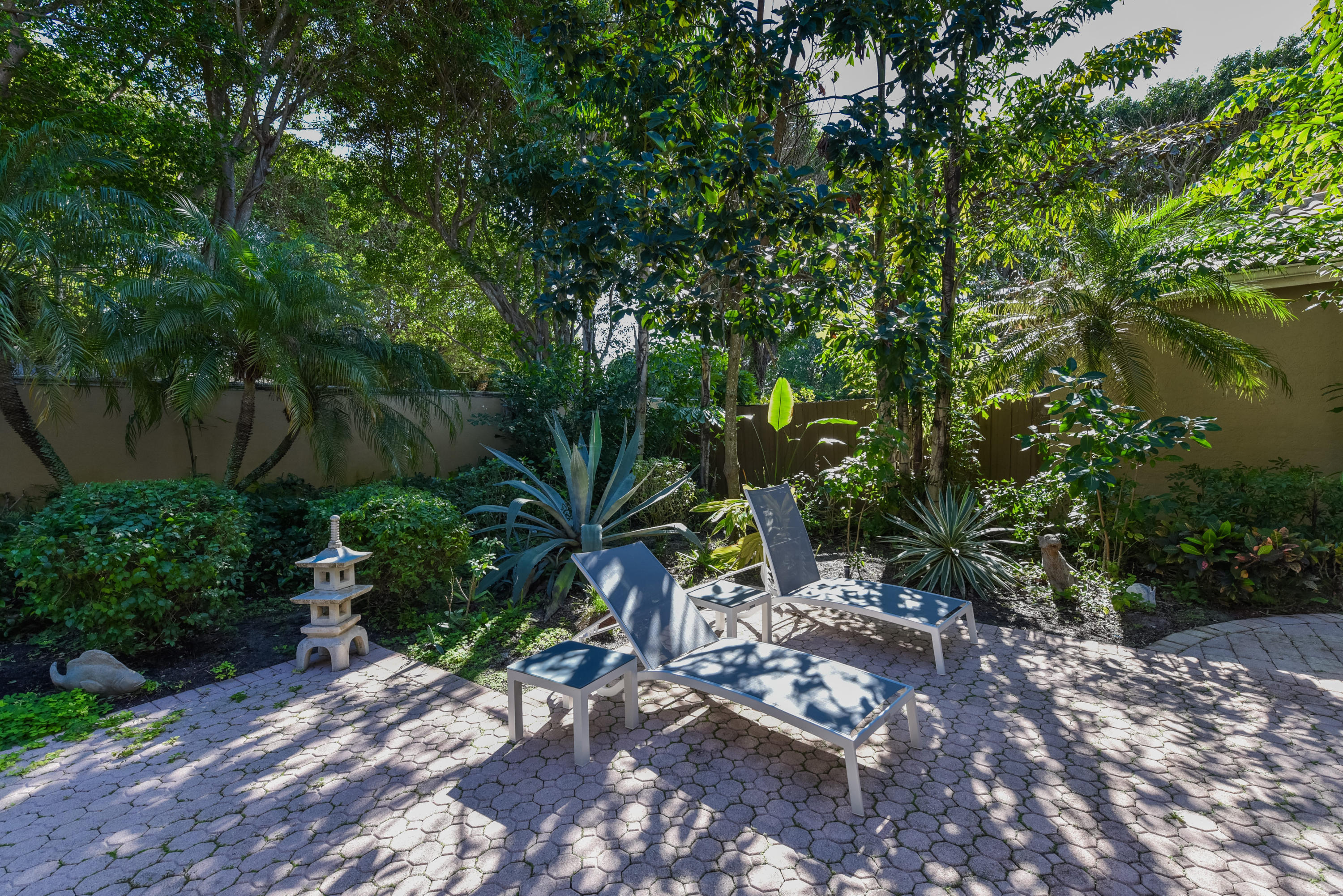 6606 Northwest 23rd Terrace Boca Raton, FL 33496 - Photo 19 of 21 a view of backyard with plants and trees