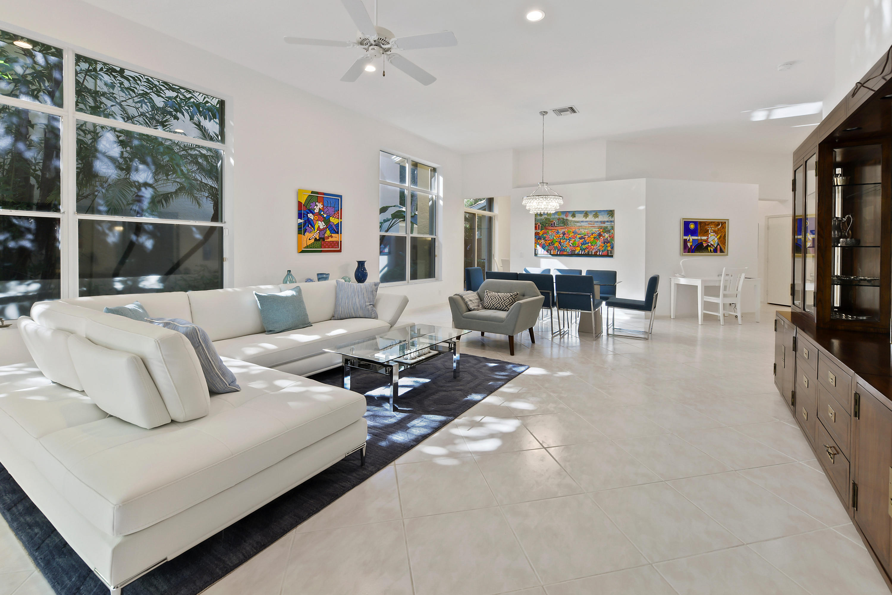 6606 Northwest 23rd Terrace Boca Raton, FL 33496 - Photo 5 of 21 a living room with furniture and a flat screen tv