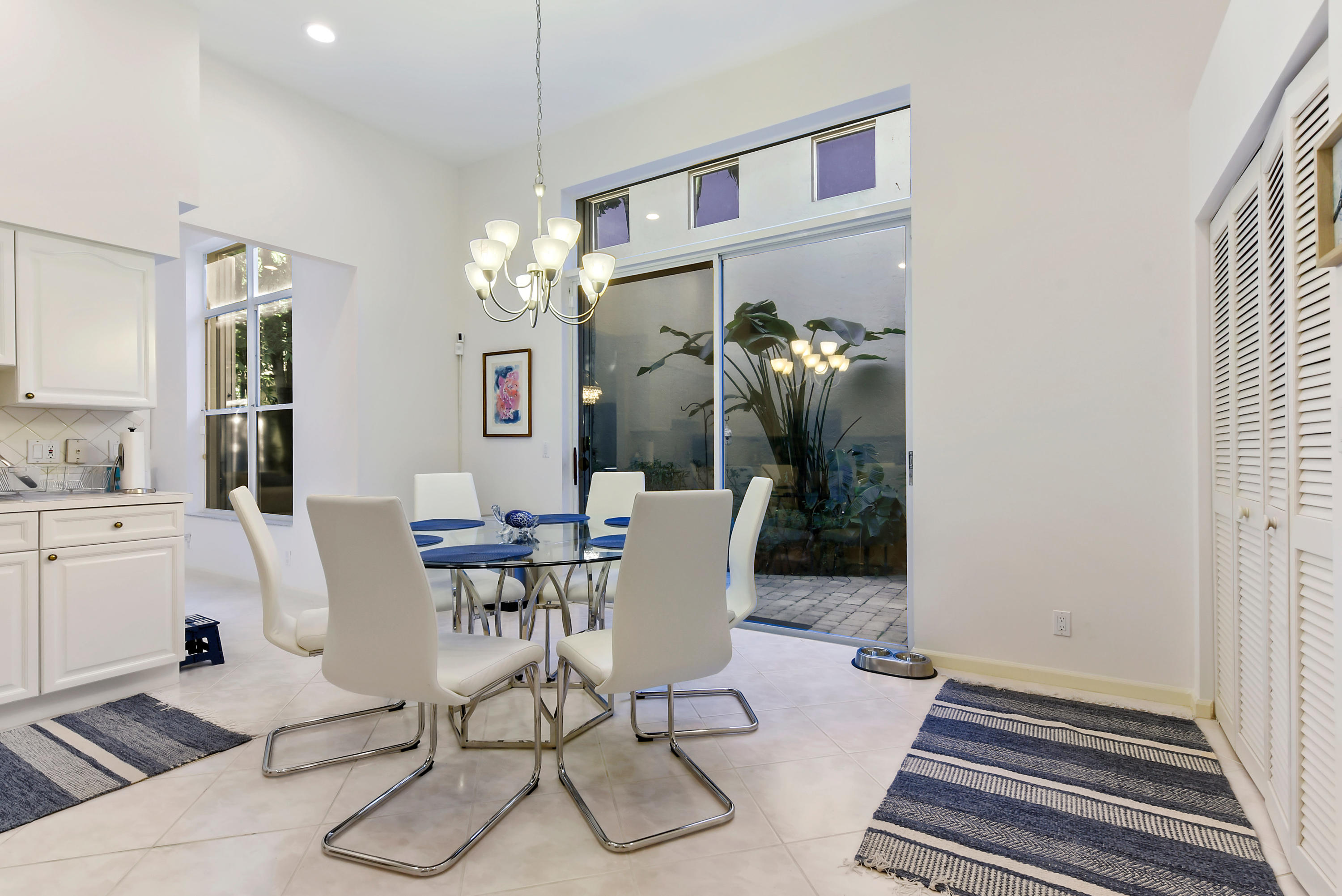 6606 Northwest 23rd Terrace Boca Raton, FL 33496 - Photo 6 of 21 a view of a dining room with furniture window and wooden floor