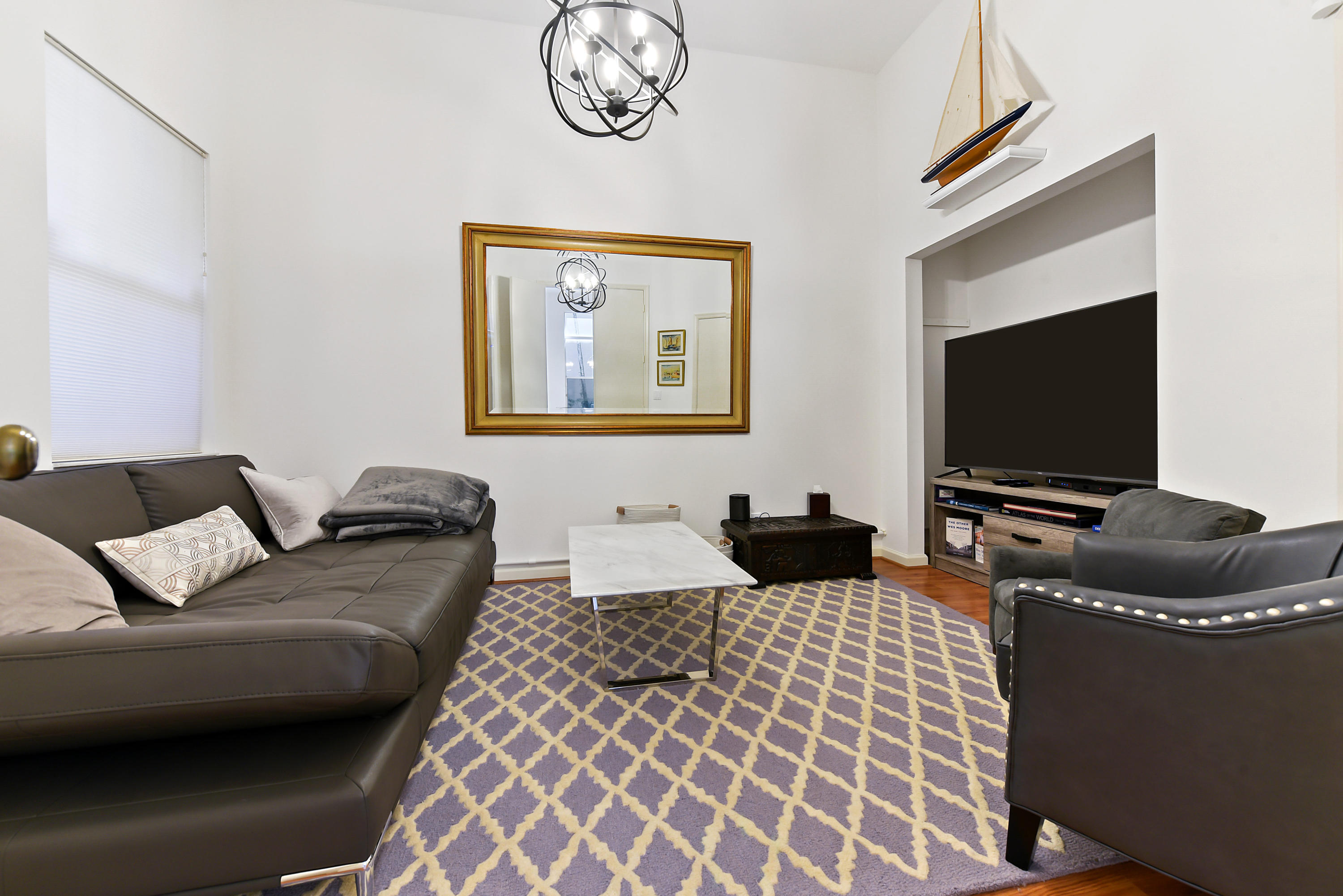 6606 Northwest 23rd Terrace Boca Raton, FL 33496 - Photo 9 of 21 a living room with furniture and a flat screen tv