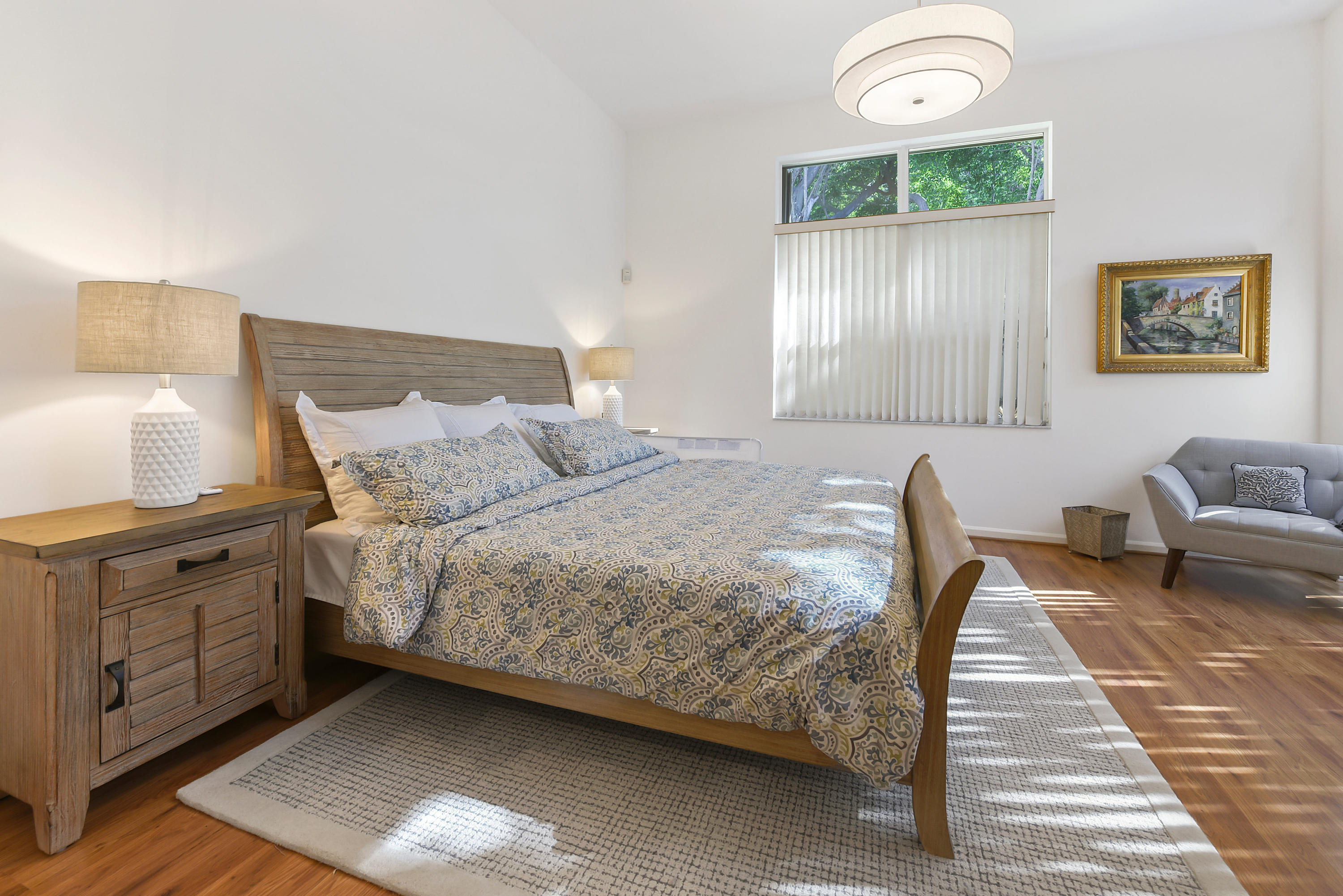 6606 Northwest 23rd Terrace Boca Raton, FL 33496 - Photo 10 of 21 a bedroom with a bed and a lamp on table