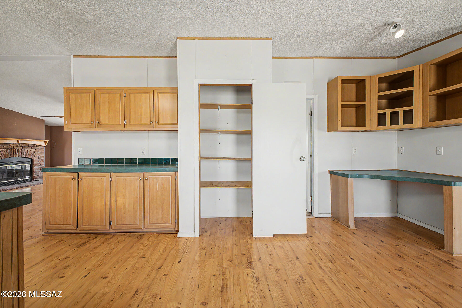 1911 West Thunder Road Vail, AZ 85641 - Photo 14 of 38 a view of an empty room with a window and wooden floor