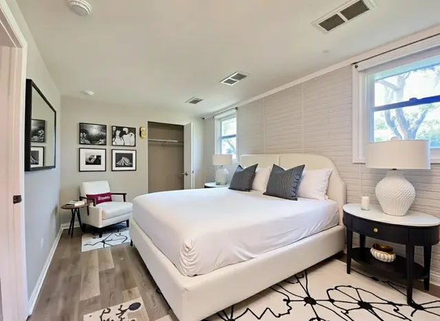 a bedroom with a bed and window