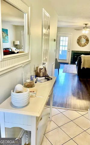 a living room with hard wood flooring and furniture